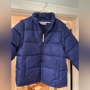 A Weworewhat Navy Blue puffer coat with removable sleeves